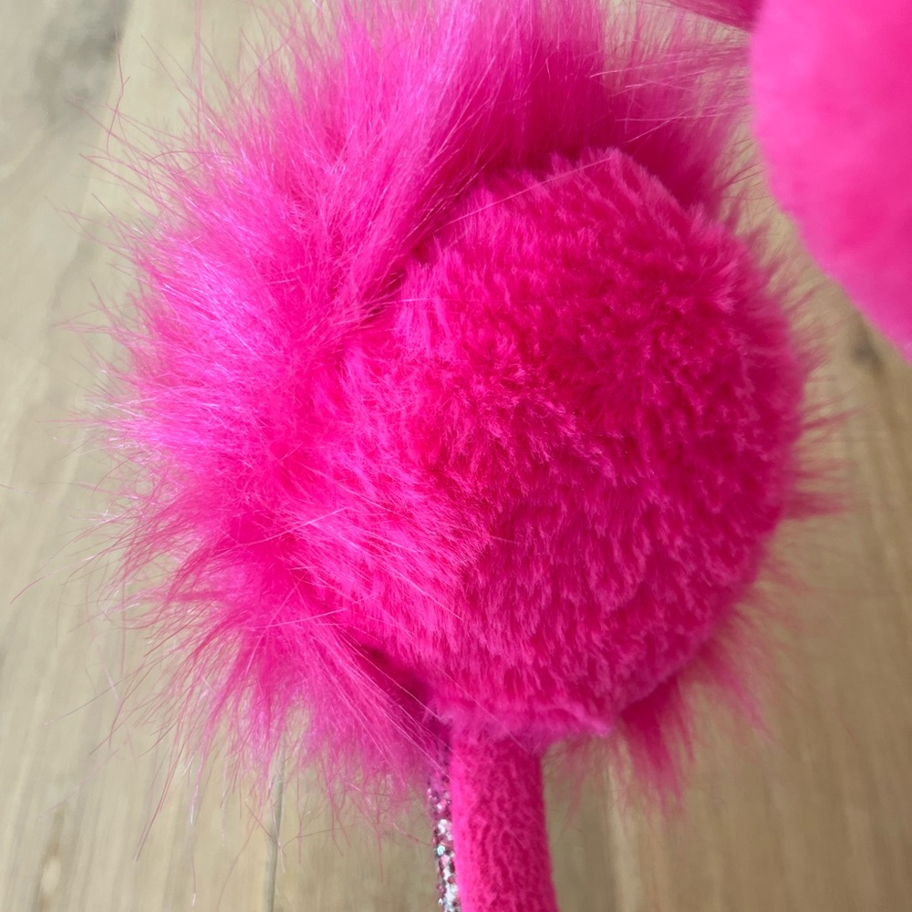 Pink fuzzy and sparkly earmuffs